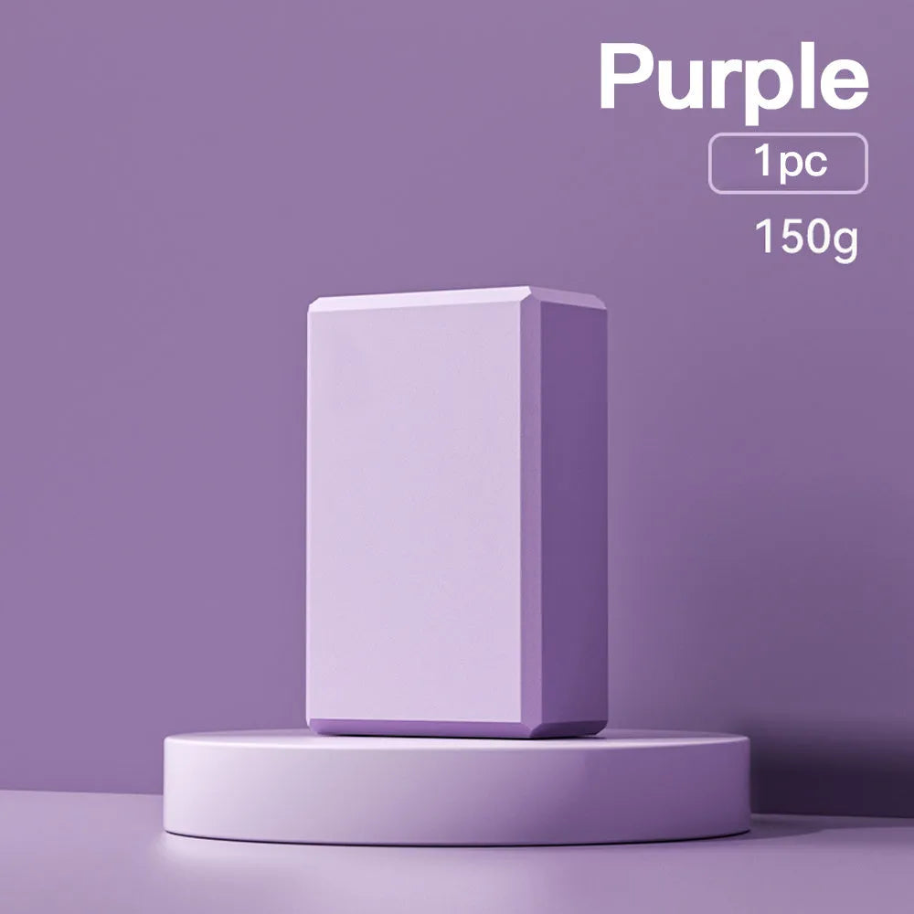 Solid colour EVA foam yoga block on a yoga mat, showing dimensions of 23x15x7.6 cm