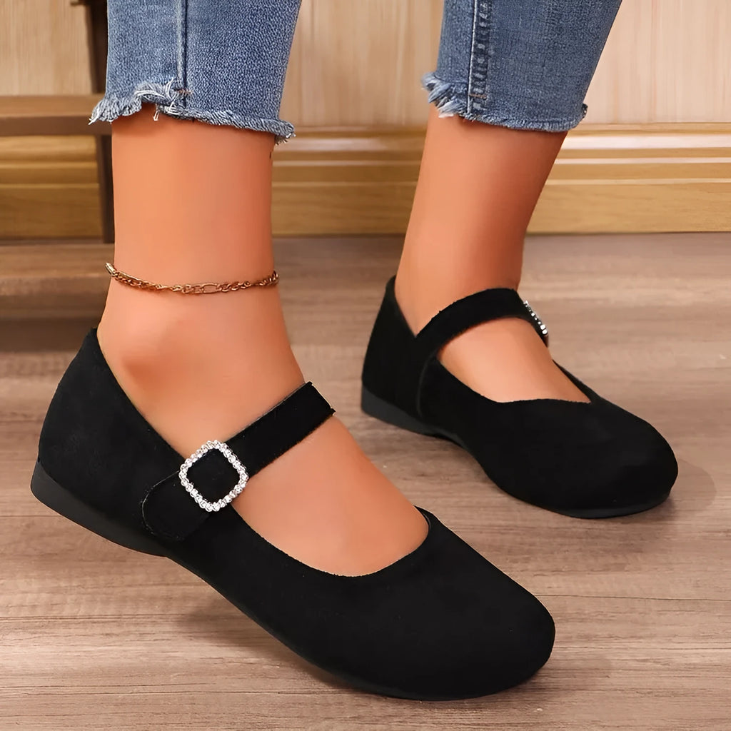 Women's solid black low-top canvas fisherman shoes with a flat rubber sole.