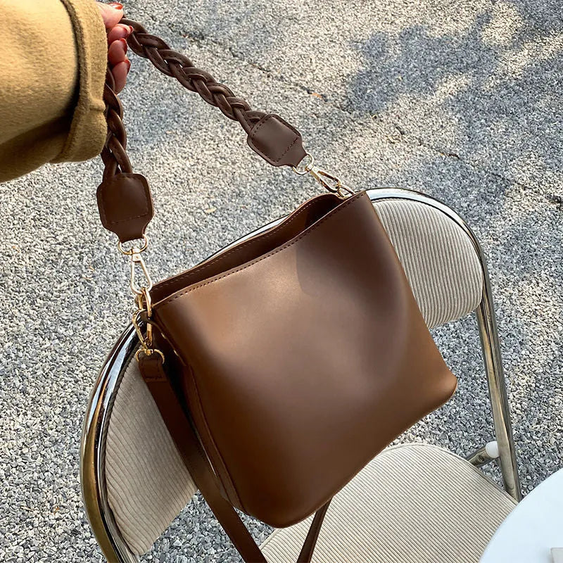 Retro one-shoulder crossbody bucket bag in woven PU material, shown in khaki colour.