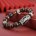 Close-up of a handmade Chinese-style bracelet with coloured glaze lucky beads on a snake theme.
