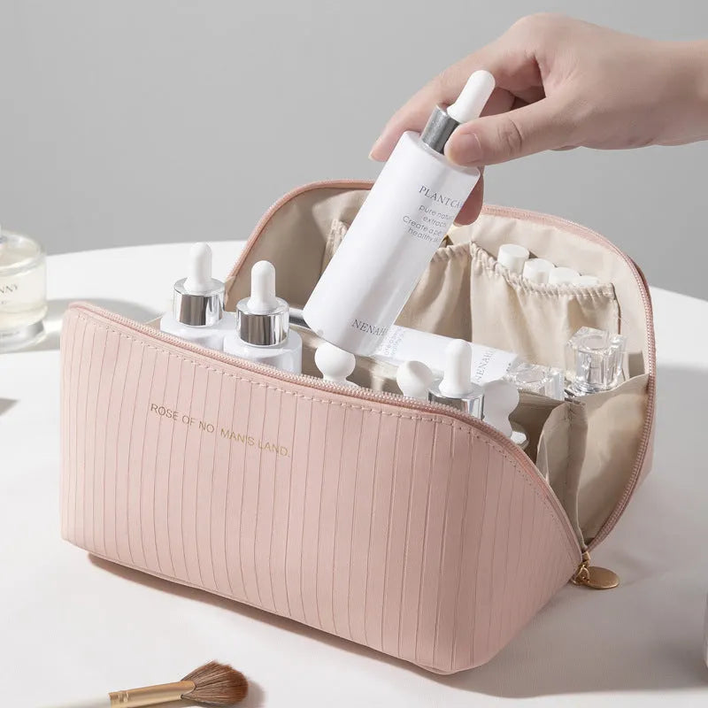 Large beige cubic PU leather makeup bag with vertical pattern, shown open.
