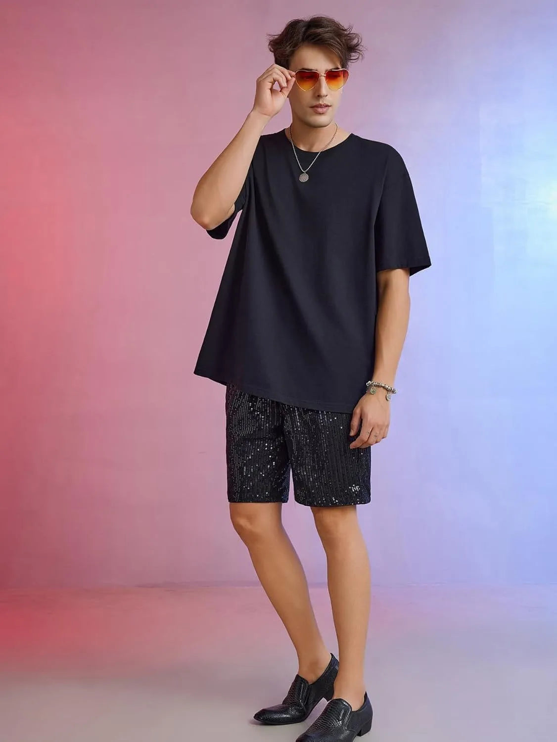 Men's straight-leg shorts with shiny sequin embellishments in silver or black, featuring an elastic waistband.