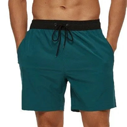 Men's blue stitching waist drawstring athletic shorts with a headband pocket and zipper fly.
