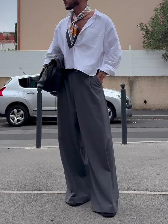 White men's casual polyester shirt with cropped top length on a hanger