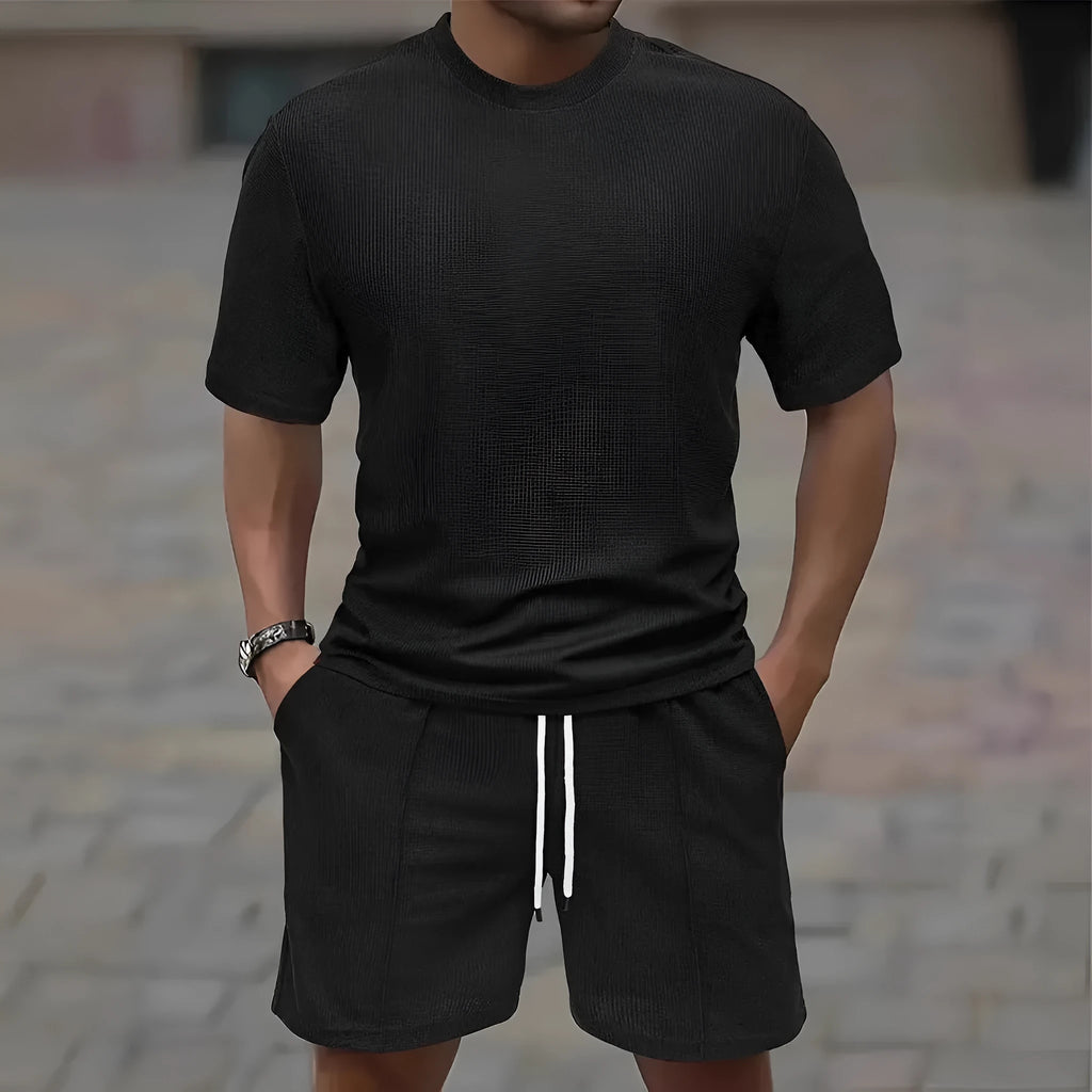 Man wearing a light apricot waffle texture short sleeve blouse and matching shorts for summer.