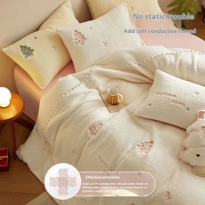 Milk fibre four-piece bedding set with green and pink Christmas tree designs on quilt cover and pillowcases.