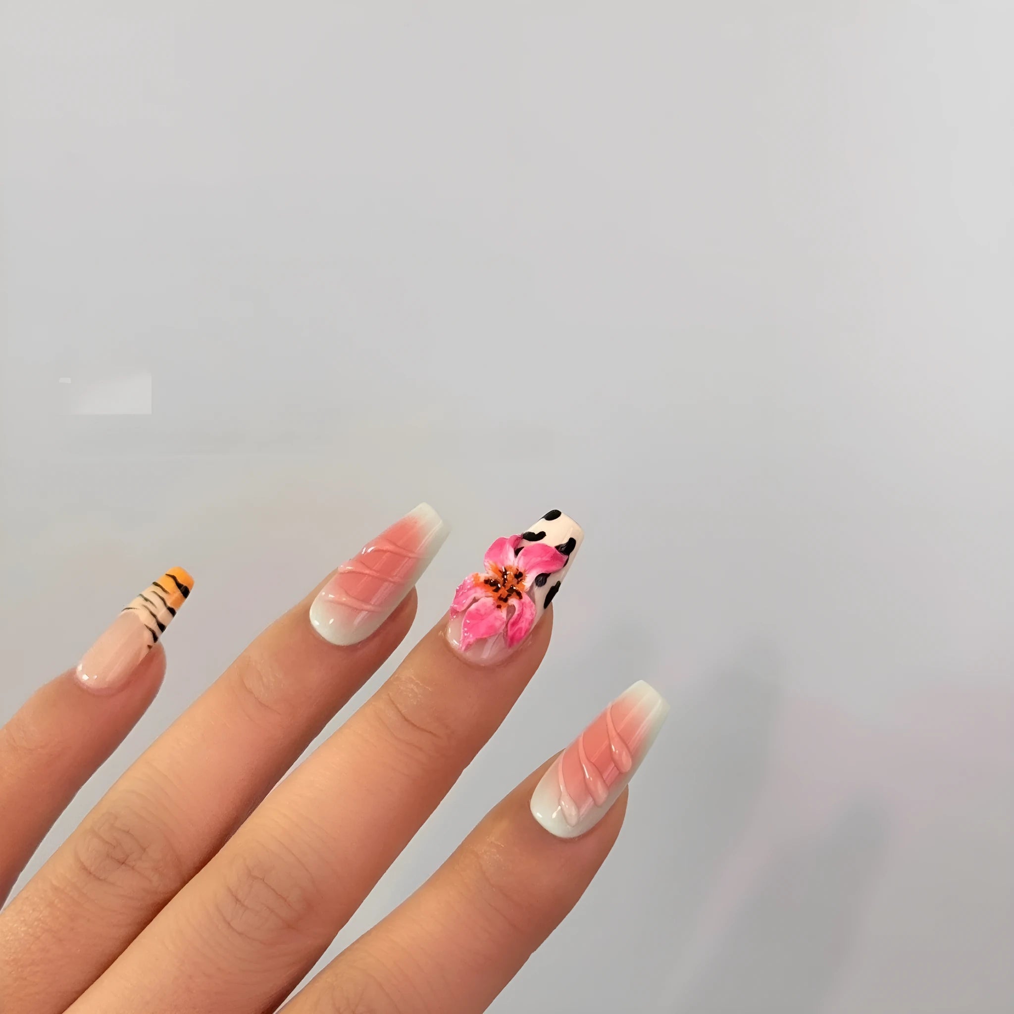 Zebra pattern lily hand carving nail art set showing embossed flower and leopard print designs