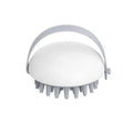 Blue silicone pet bathing brush with soft bristles for washing and massaging cats or dogs.