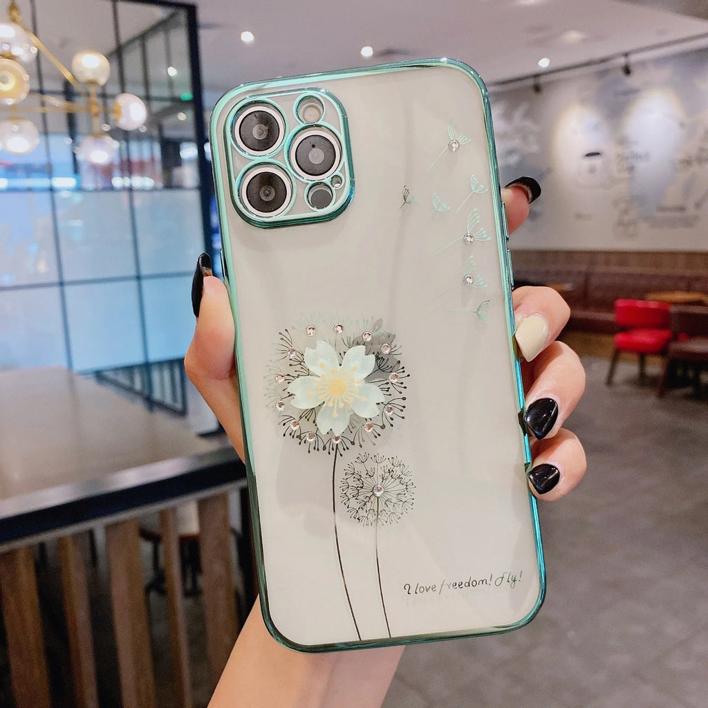 Green iPhone case with 3D white floral design and a silver rotating kickstand extended at the back.