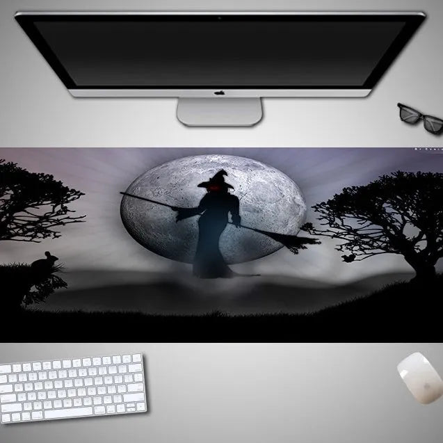 Large Halloween-themed rubber cloth mouse pad on a desk, showing non-slip backing and graphic design.