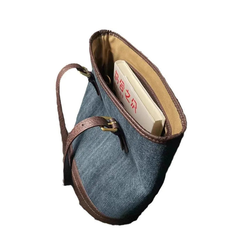 Retro blue denim patchwork one-shoulder bucket bag with large capacity.