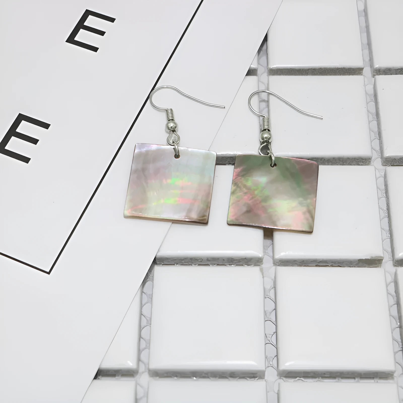 Geometric shell earrings in rectangular shell or square panther designs