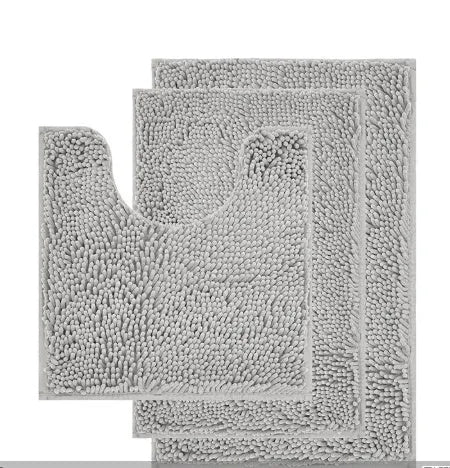 Chenille U-shaped three-piece bathroom carpet set in green beside a toilet.