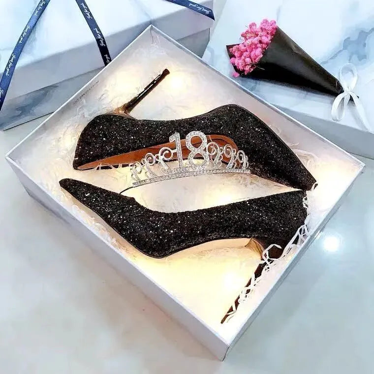 Women's silver and black bridal stiletto shoes with PU leather construction on a white background.