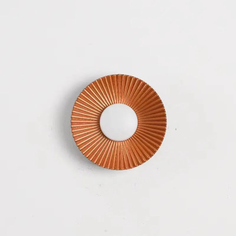 Round wall-mounted LED light with aluminium shade in a gold and white two-tone colour option.