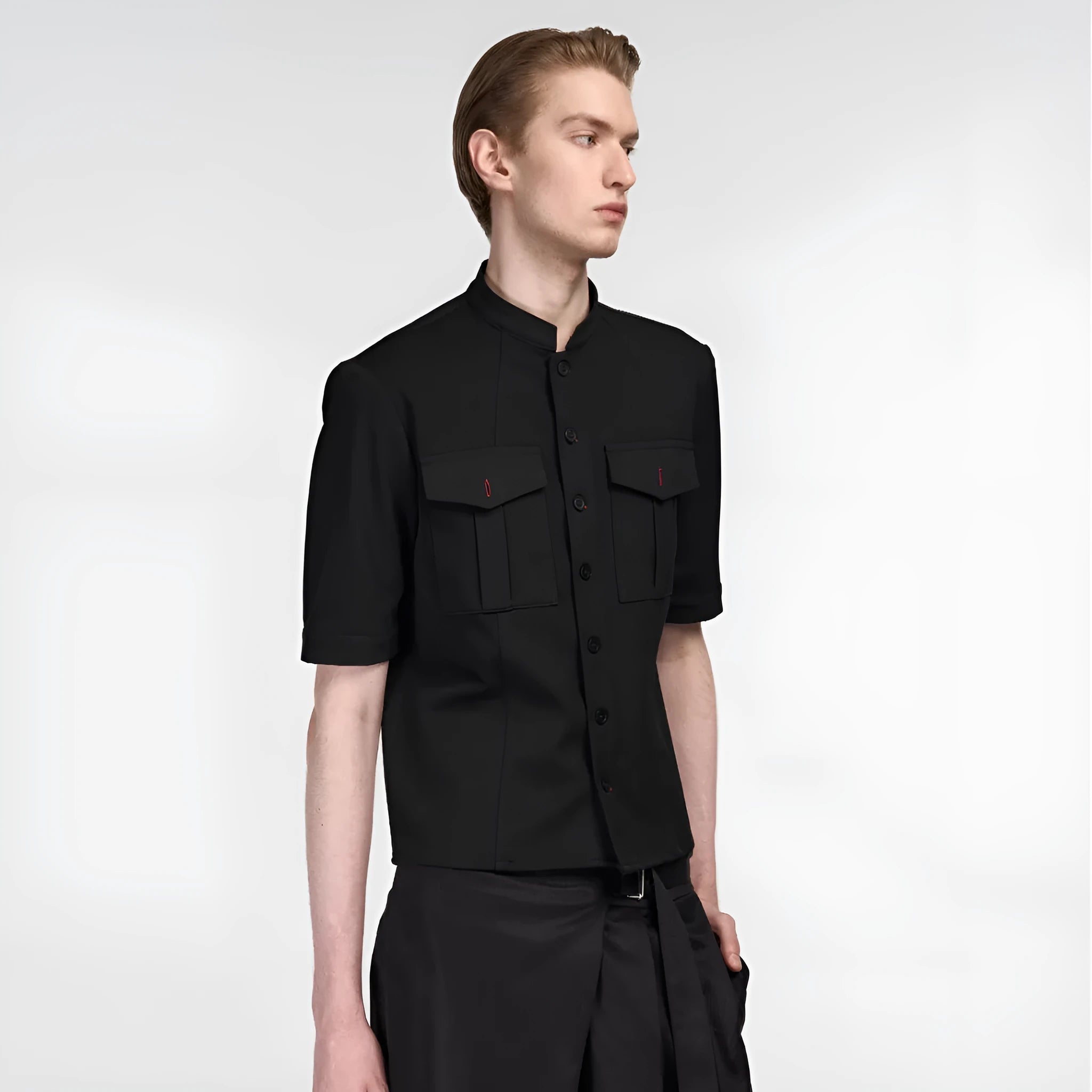 Handmade black loose-fit half sleeve hunting shirt with a shirt collar on a hanger.