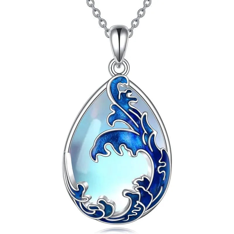 Blue alloy love heart pendant on a women's necklace chain.