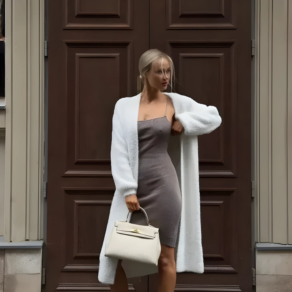 White knitted cardigan jacket for women with long sleeves and a loose fit.