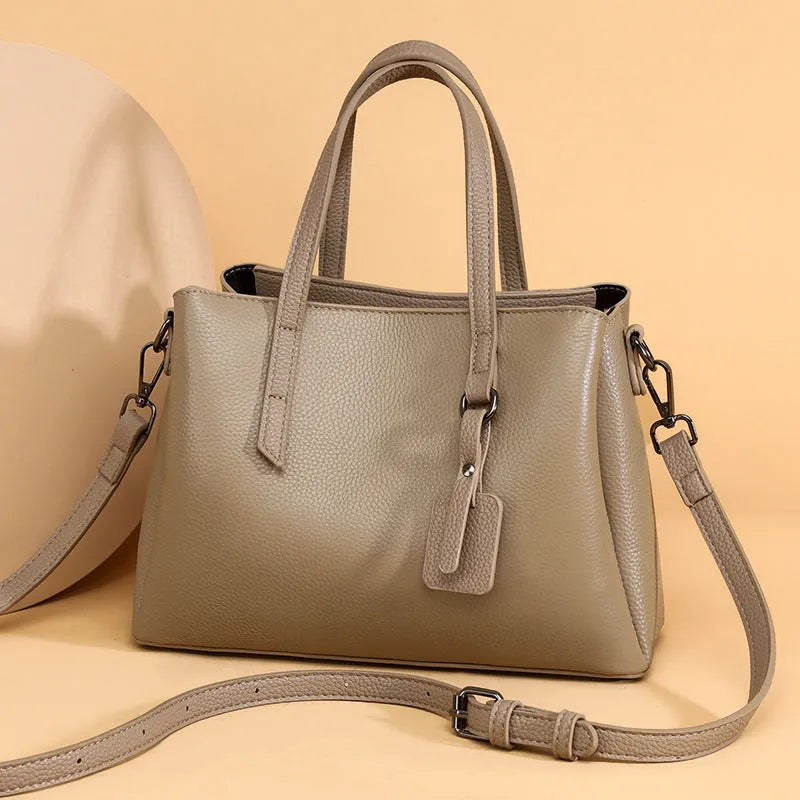 Women's genuine cowhide leather handbag in horizontal square shape with multiple internal compartments