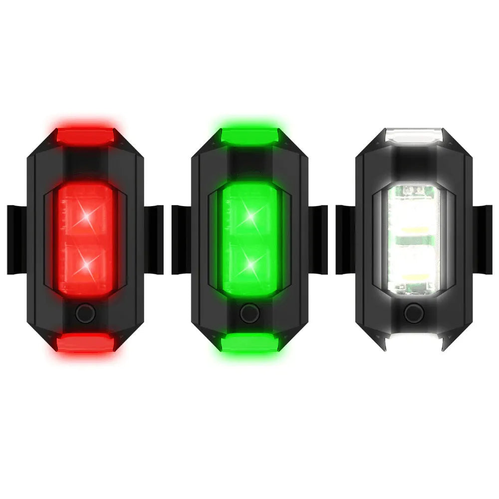 Drone strobe signal light with RGB LEDs next to Type-C charging cable and roll of mounting tape.
