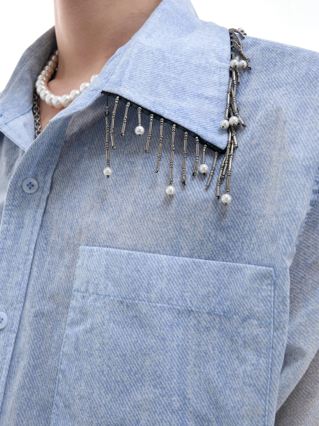 Blue and white gradient short-sleeved loose-fit shirt on a hanger.