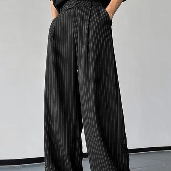Men's black vertical striped pleated casual trousers showing elastic fabric and Asian sizing options