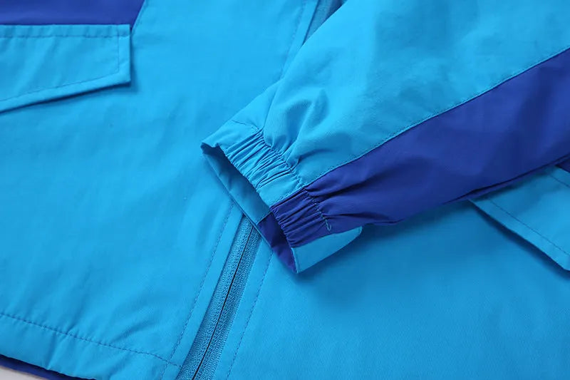 Boys' blue sanded acetate fibre autumn jacket with long sleeves and front zip.