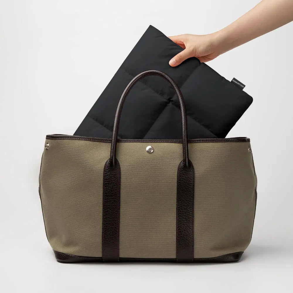 Soft black polyester laptop sleeve with sewing thread detail fitting 13-inch to 15.6-inch laptops