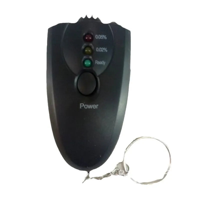 Black portable wine tester with LED display and keychain against a white background