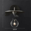 Modern wrought iron glass wall lamp with gold bronze finish and triangular transparent glass shade