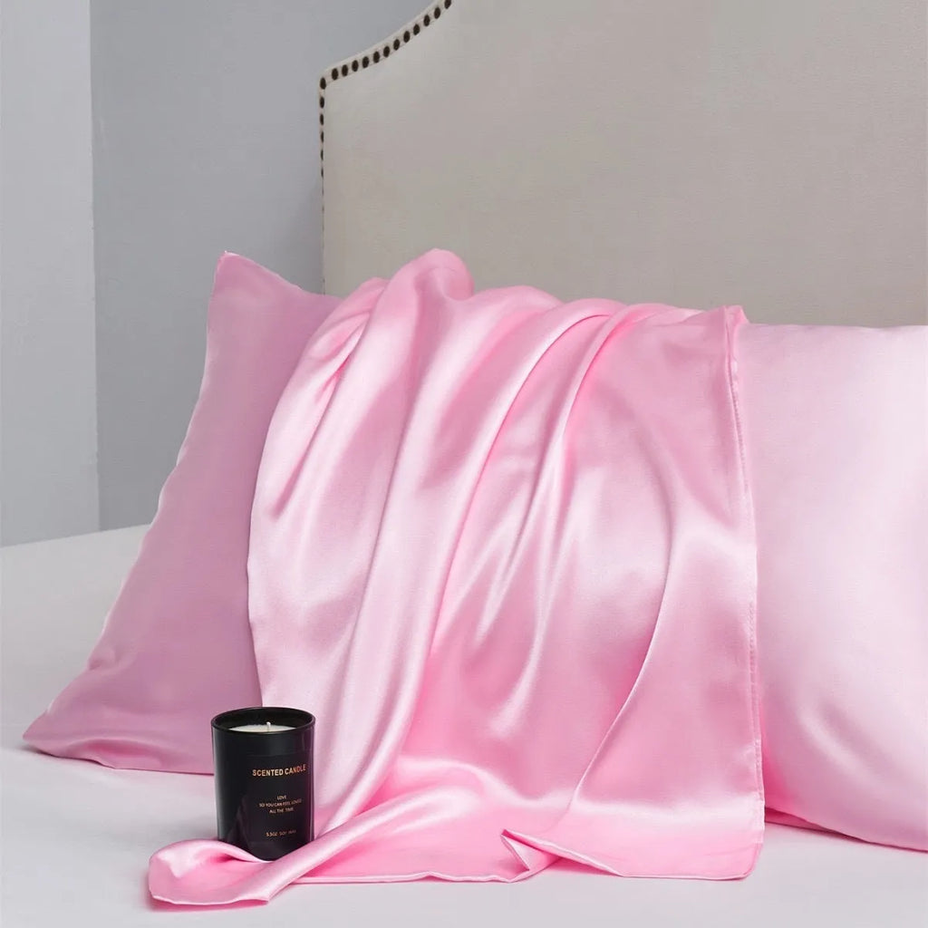 A pair of solid colour satin pillowcases made from polyester fibre, shown in one of 13 available colours.