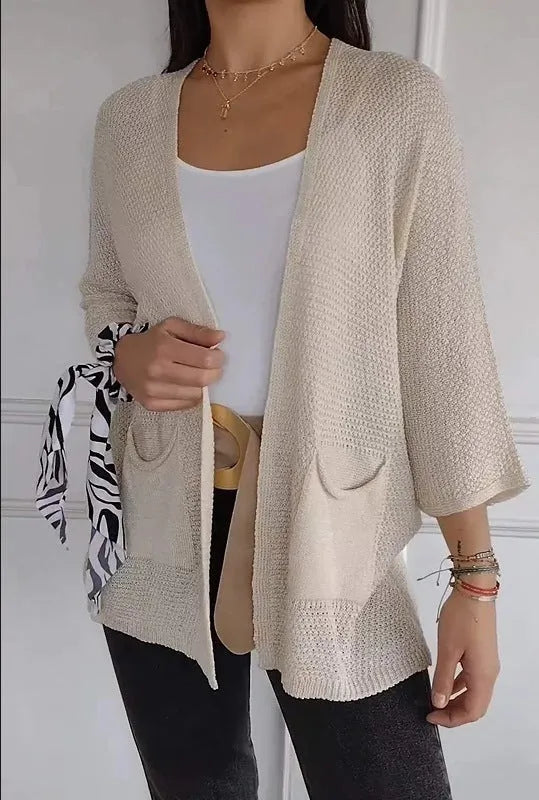 Women's waffle-textured cardigan coat in army green with nine-quarter sleeves and front pockets.