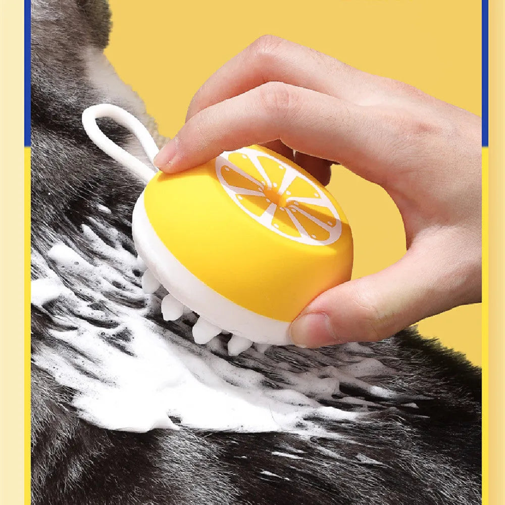 Yellow silicone pet bath brush showing massage head and comb sides on a 102mm scale.