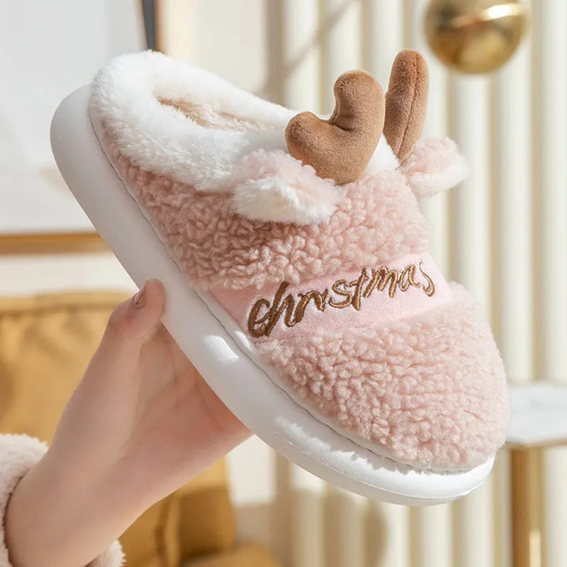 Christmas elk winter home slippers in pink with suede upper and thickened EVA sole on a cream background