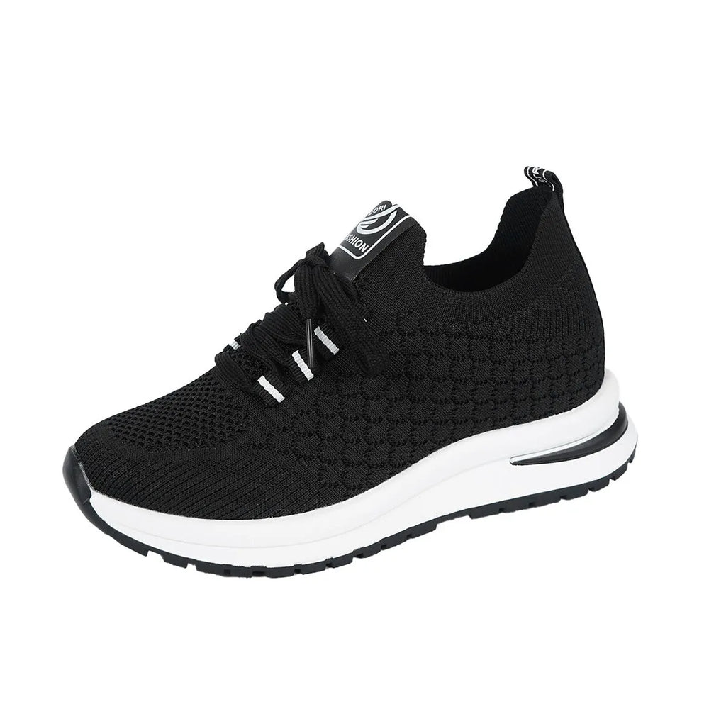 Women's black and white mesh lace-up flat pumps with a round toe and rubber sole.