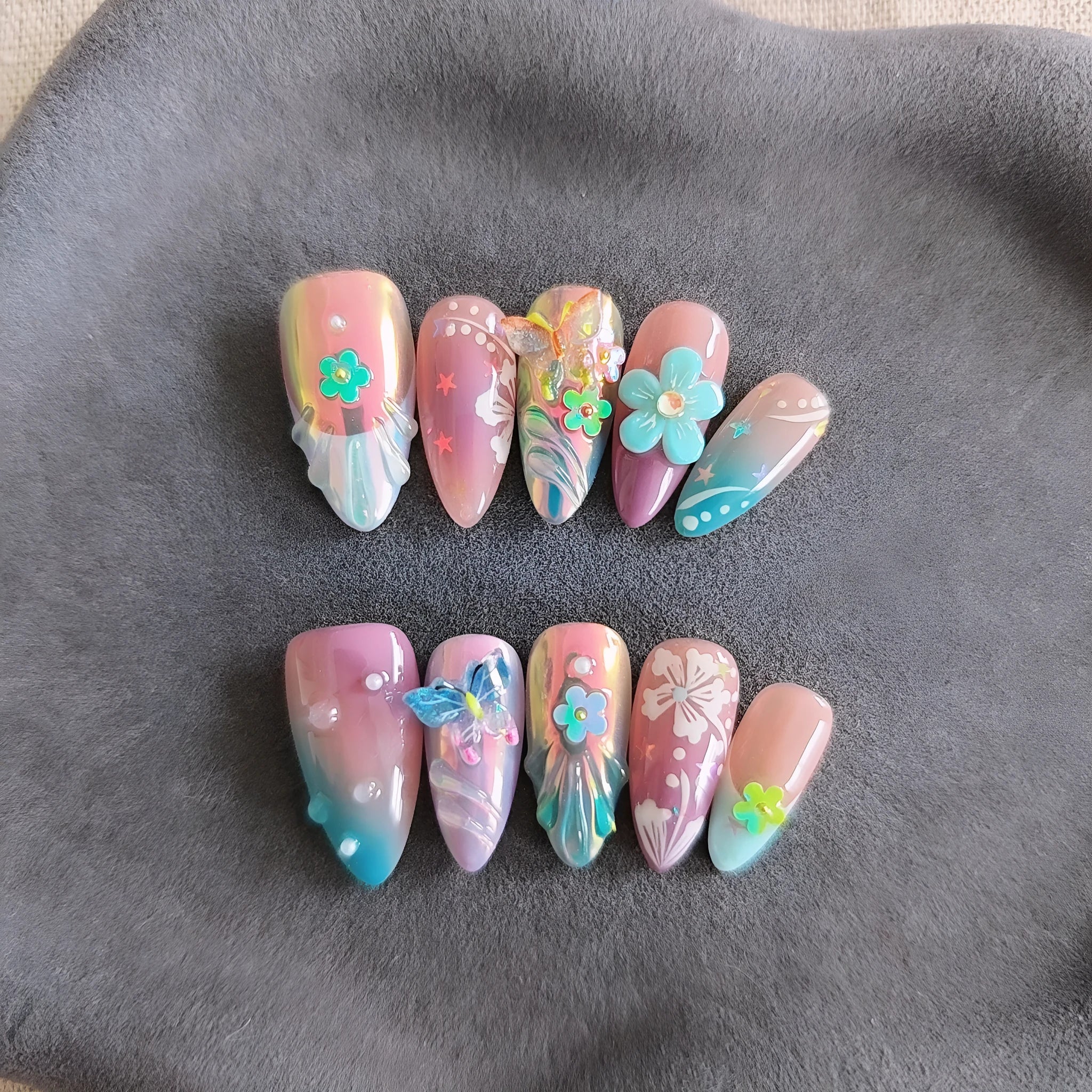 Handmade colourful flower and butterfly nail art decorations in four sizes