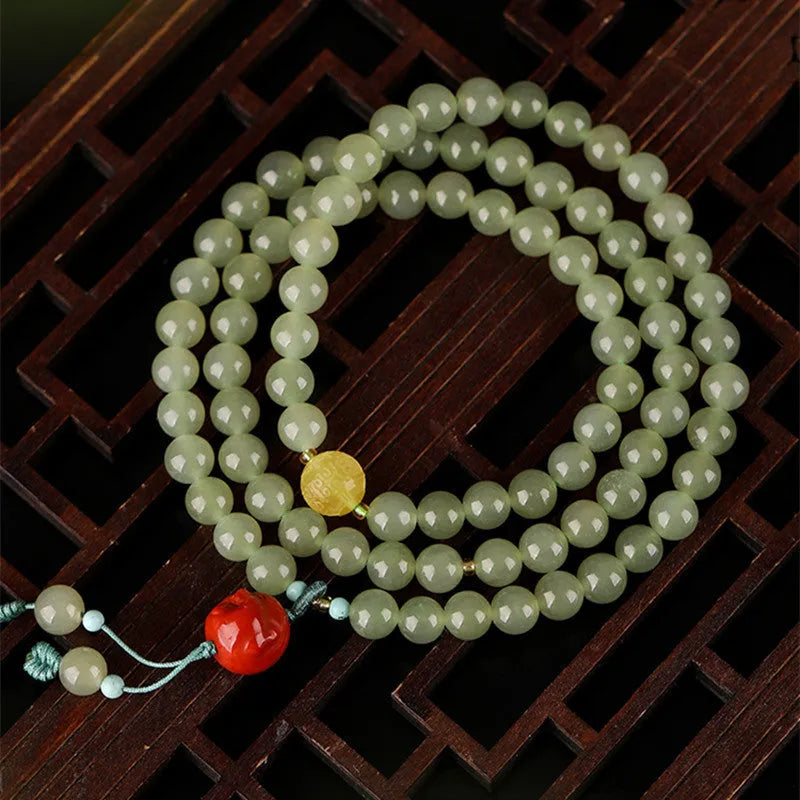 Pale blue Hetian jade bracelet with 6mm beads arranged in three-circle pattern