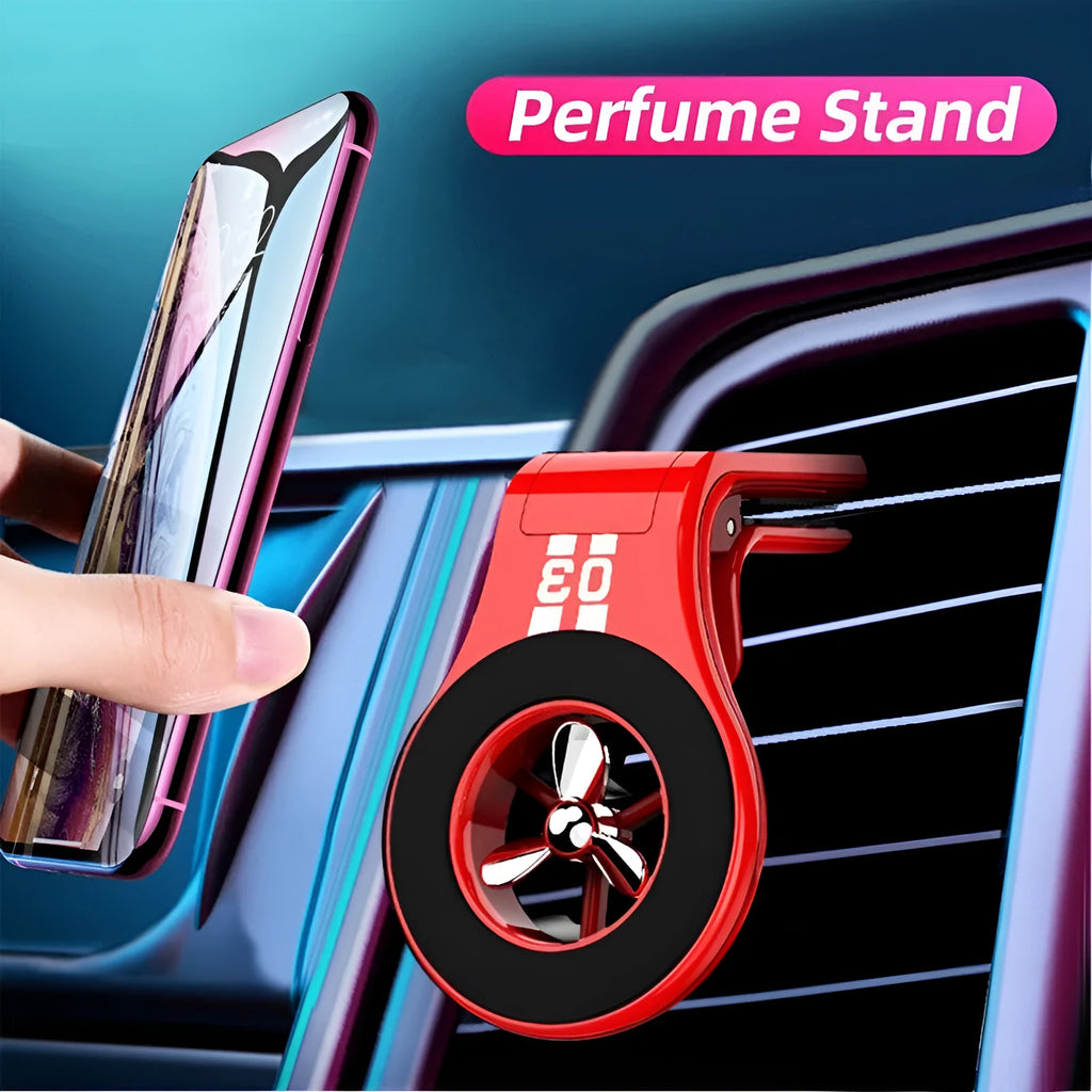 Black magnetic car phone holder clipped to a car air vent, holding a smartphone.