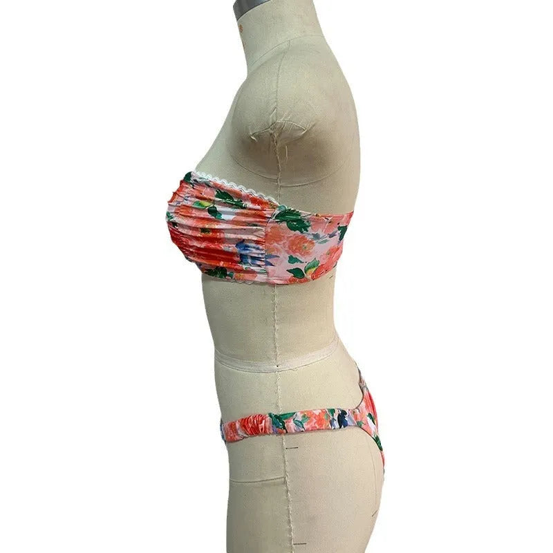 Women's polyester bikini set with floral print tube top and matching briefs for swimming.