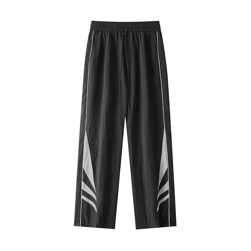 Men's straight leg trousers in black, showing button fly and elastic waistband on a hanger.