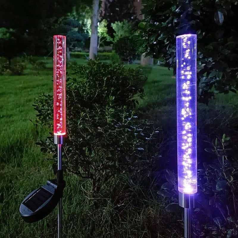 Solar bubble stick lawn lamp with colourful slow flash crystal bubble effect in garden setting