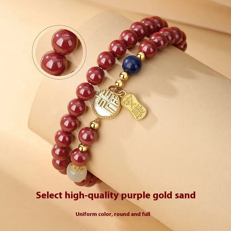 Close-up of a women's 925 sterling silver bracelet with a purple gold sandstone blessing charm and 6mm beads.