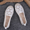 Women's flat-heel linen fisherman shoes in pansy white with sewing thread detail and round toe.