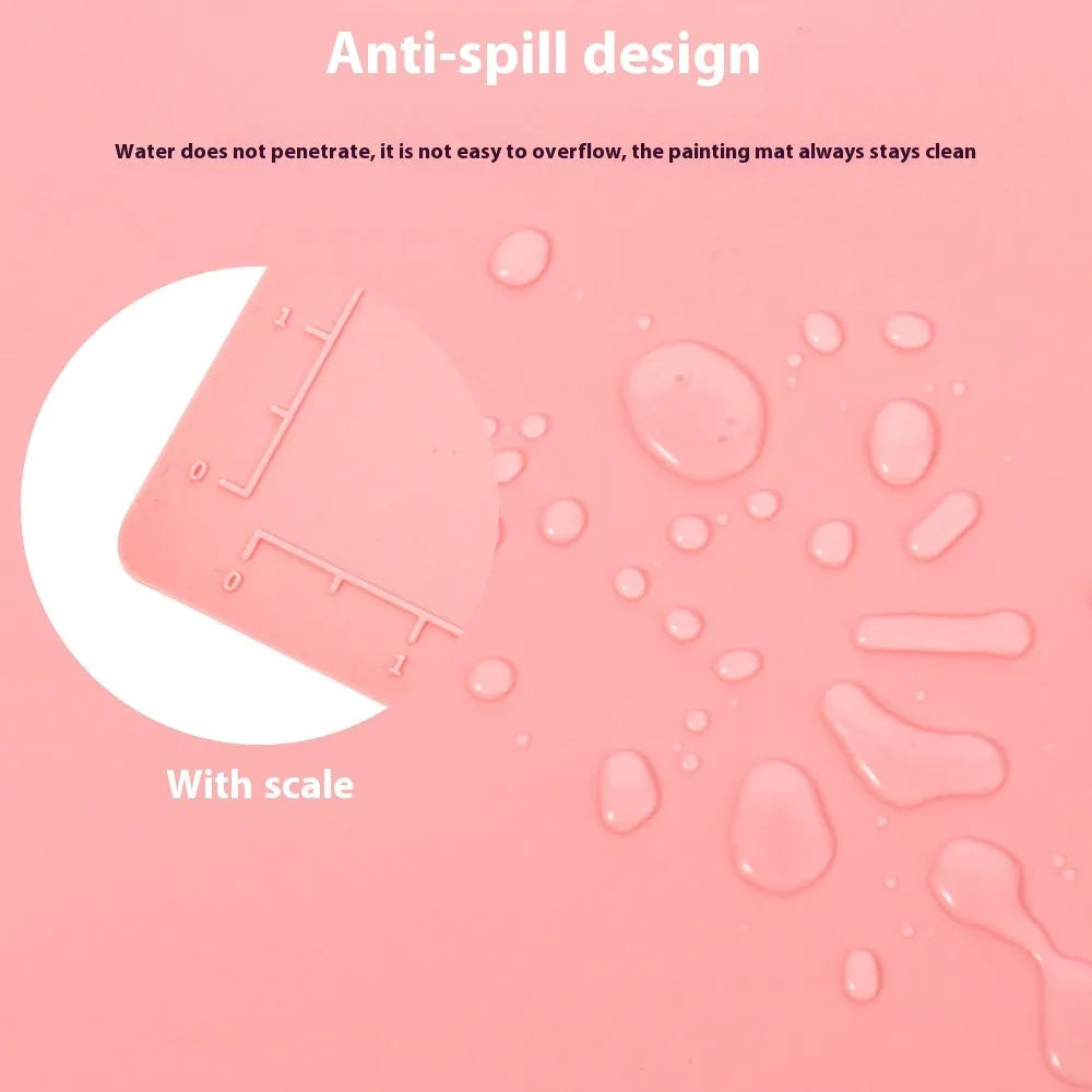 Large light blue silicone painting mat with dimensions 50cm by 40cm laid flat on a table.