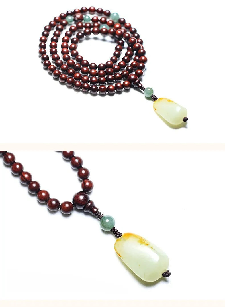 A wooden beaded bracelet with a carved green Hotian jade pendant on a natural background.