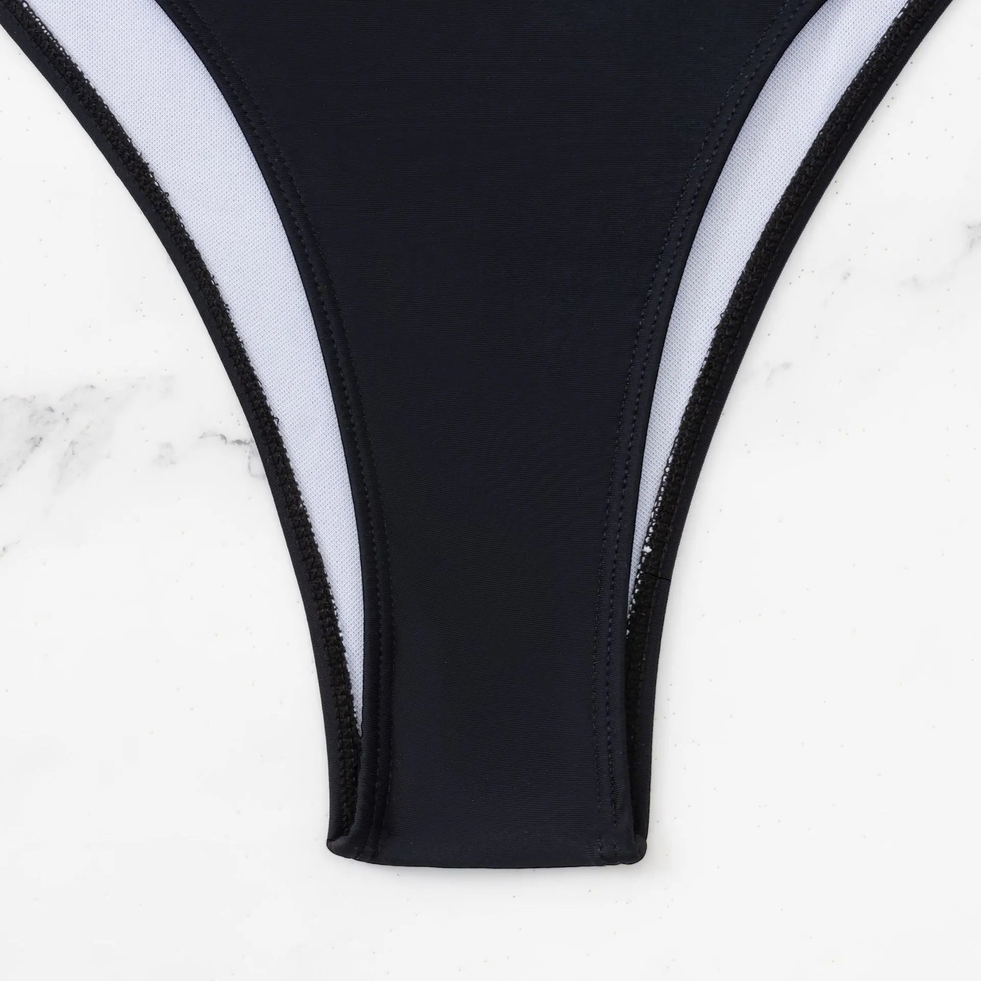 Black women's one-piece swimsuit with hollow design and contrast stitching detail