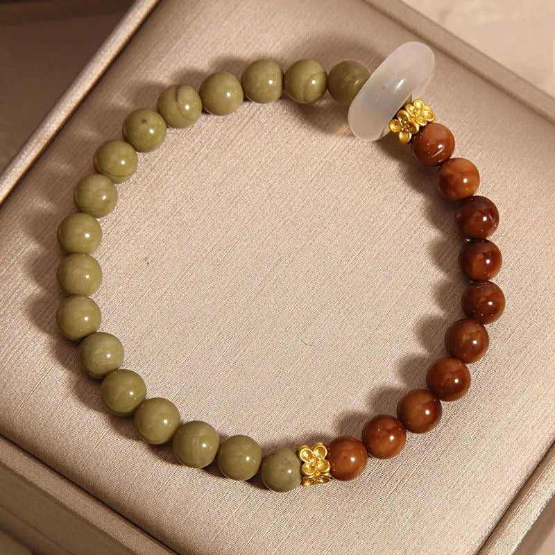 Green gradient women's bracelet with crown and geometric shapes in a Chinese style design