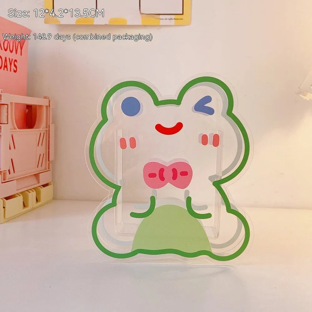 Square transparent acrylic storage box with a cute decorative design, shown on a desk.