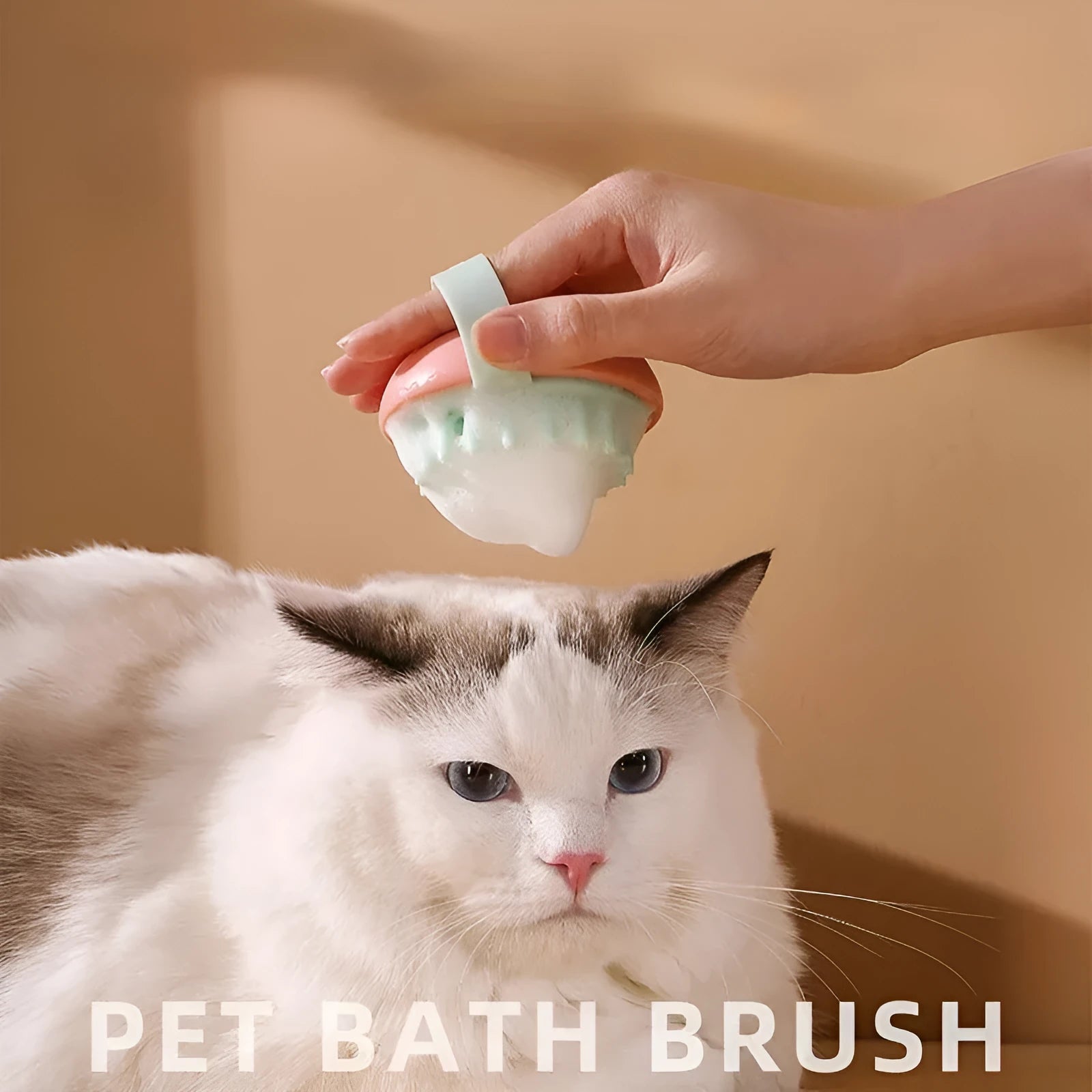 Blue silicone pet bathing brush with soft bristles for washing and massaging cats or dogs.
