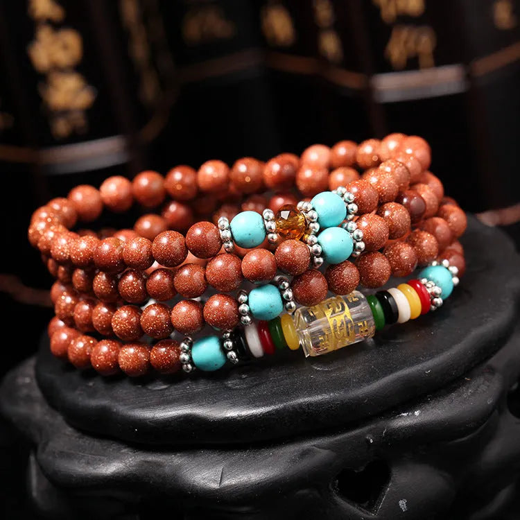 Women's golden star stone mantra bracelet with 108 nugget sand pieces and Chinese fu character ornament